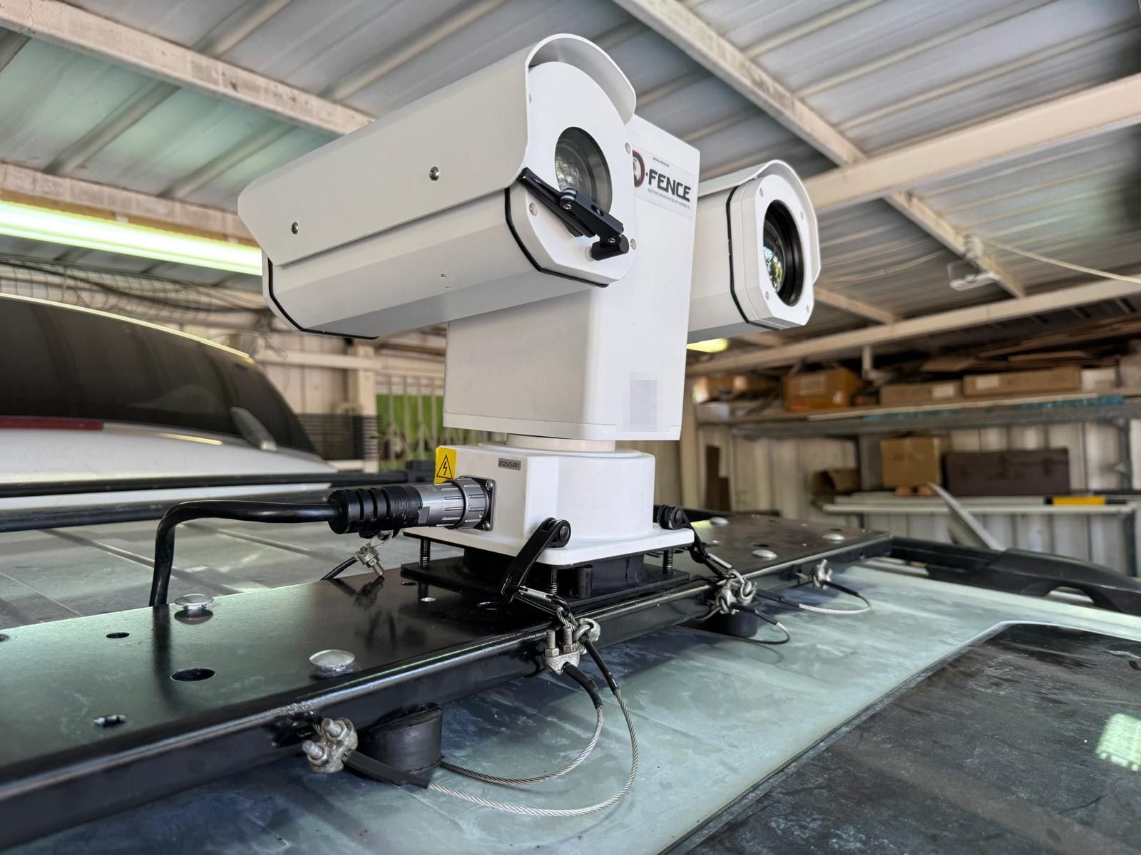 NOA day and thermal PTZ camera head on the roof rack of a patrol vehicle