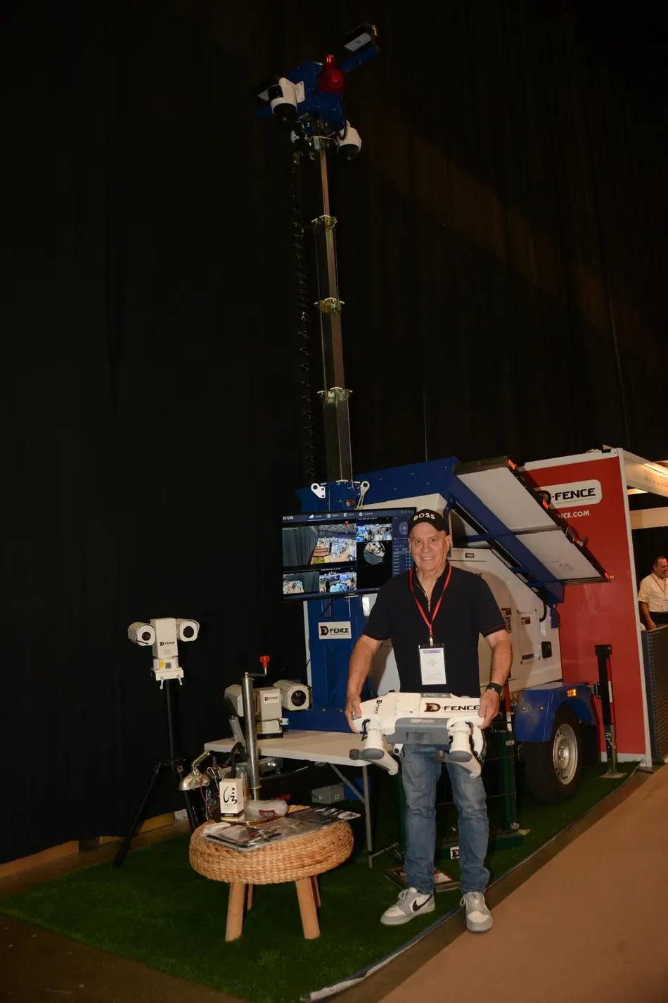 The D-FENCE exhibition stand with the solar observation trailer, day and thermal cameras and a D-FENCE drone