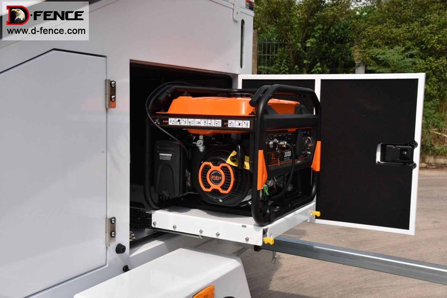 Backup generator on a slide-out drawer, pulled out of the side compartment of a solar surveillance trailer