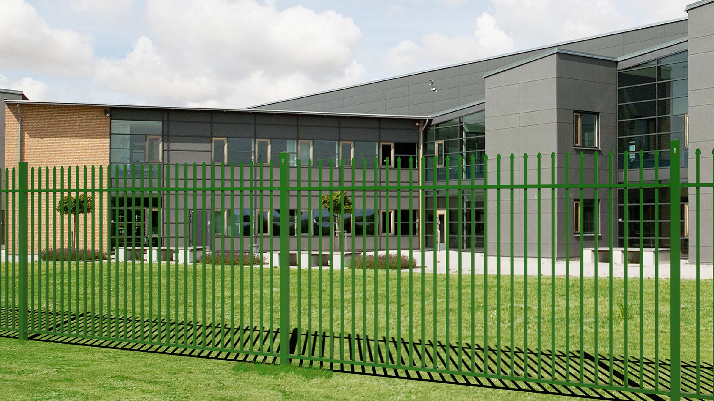 Render: green D-Corative fence along the lawn of a school or office campus