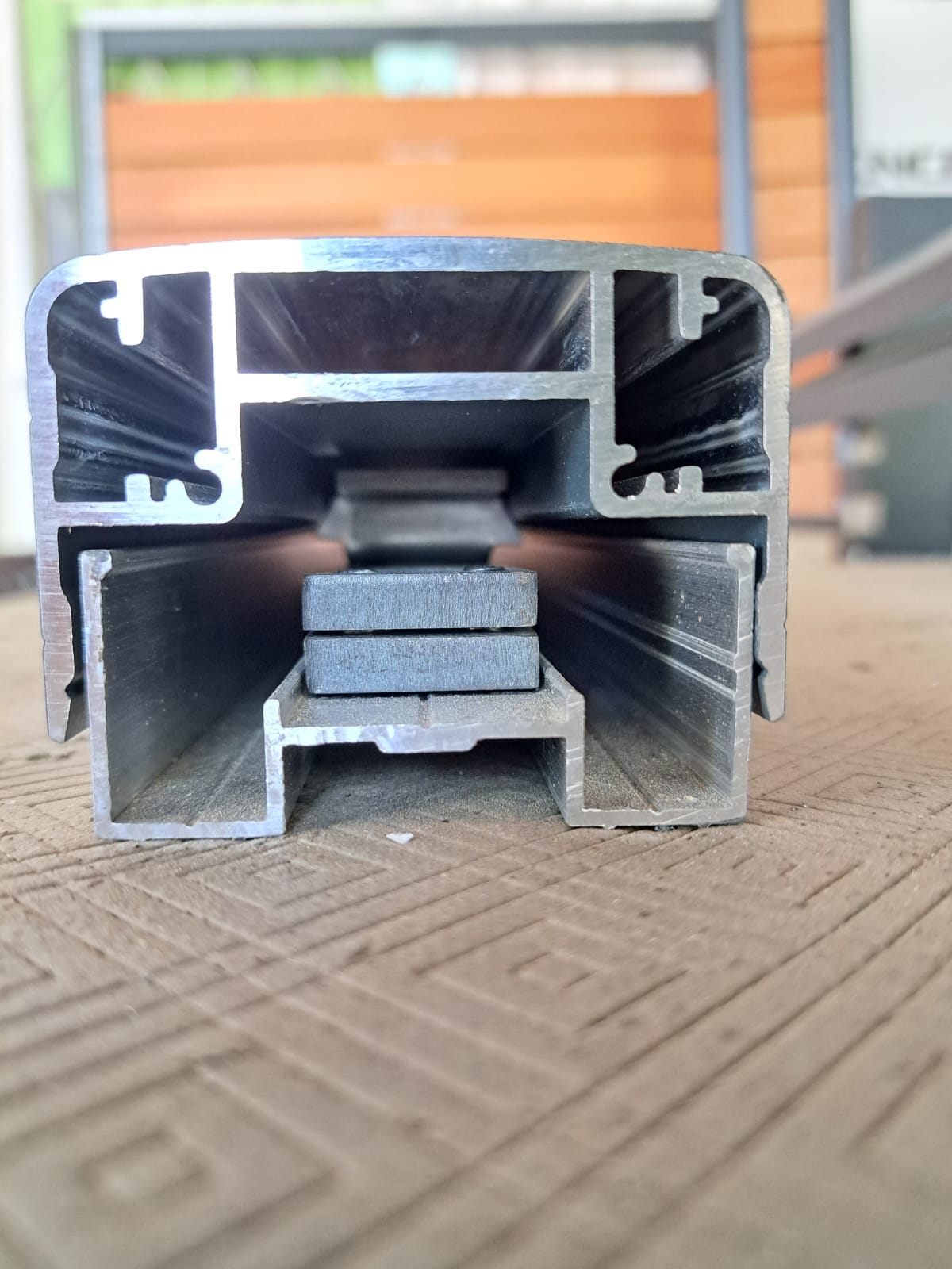 Close-up of the aluminium profile cut end with the sensor block inside